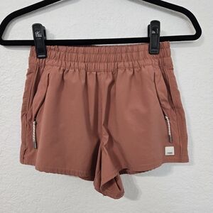Vuori Women's Athletic Shorts in Rust